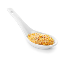Dijon mustard in spoon on white background