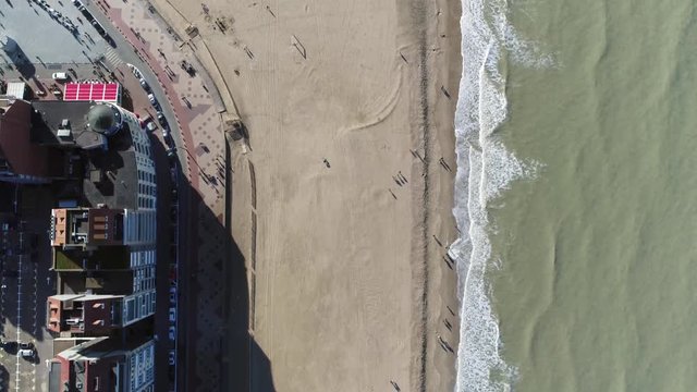 Aerial footage Knokke-Heist beach and boulevard the city is located along North Sea on Belgian border with the Netherlands and is Belgiums best-known and most affluent seaside resort 4k quality