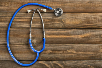 Stethoscope on wooden background
