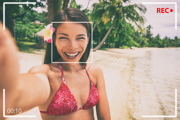 Selfie photo on beach Asian woman taking video recording on travel holiday in luxury Bora Bora...