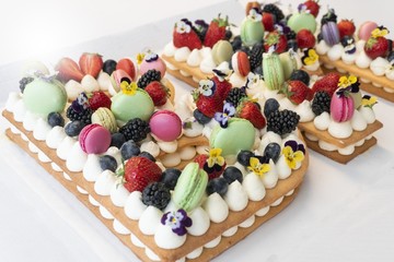 Delicious cheese cake with berries and whipped cream. 
