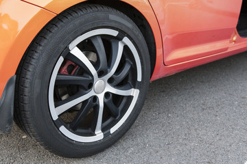 Obraz na płótnie Canvas Rear aluminum rim and rubber from car.