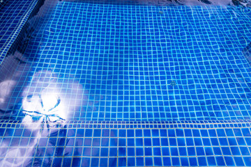 Swimming pool blue texture background.