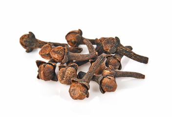 dry cloves on white background
