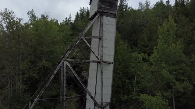 Aerial view of an abandoned old mining head frame outside of a forgotten silver mine in Cobalt Ontario Canada