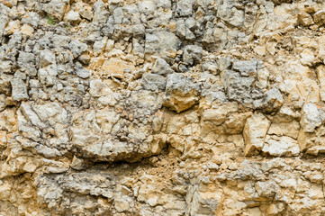 Textured stone background Rubble ballast in natural form in the rock wall