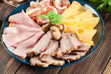 Cold meat platter with ham, prosciutto, bacon and cheese