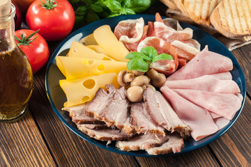 Cold meat platter with ham, prosciutto, bacon and cheese