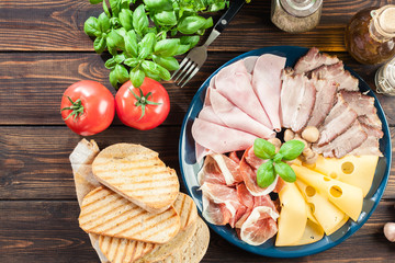 Cold meat platter with ham, prosciutto, bacon and cheese