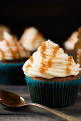 Caramel cupcakes on a dark background