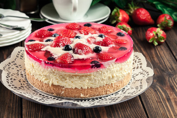 Cheesecake with strawberries, blueberry and jelly