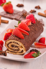 Chocolate roll with strawberries.
