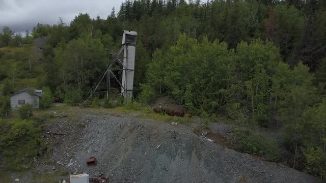 Aerial view of an abandoned old mining head frame outside of a forgotten silver mine in Cobalt Ontario Canada