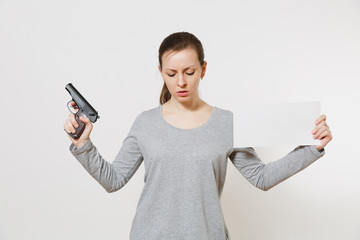 Woman holding gun, blank empty sheet card, copy space isolated on white background. Girl hand no...