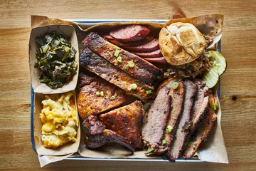 Plexiglas foto achterwand texas bbq style tray with smoked beef brisket, st louis ribs, chicken and hot links © Joshua Resnick