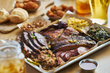 texas style bbq tray with smoked brisket, st louis ribs, pulled pork, chicken, hot links, and sides
