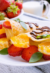 Pancakes with sliced strawberries