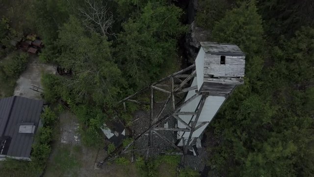 Aerial view of an abandoned old mining head frame outside of a forgotten silver mine in Cobalt Ontario Canada