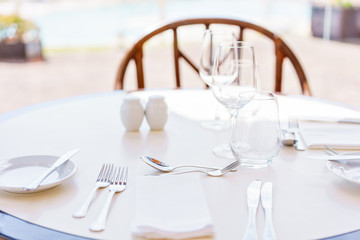 Classic Dinnerware in the restaurant. Table appointments for dinner on terrace