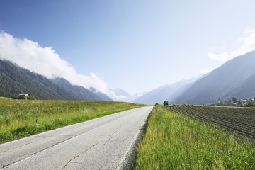 Empty road to mountains