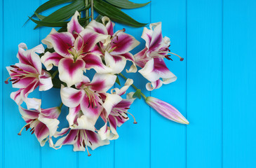  lily flowers on wooden planks