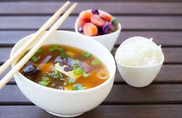Traditional vegan miso soup with silken tofu, shiitake, dashi and scallion served with white rice and pickled vegetables