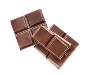 Pieces of dark chocolate on white background