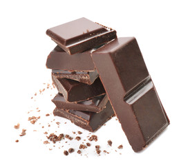 Pieces of dark chocolate on white background