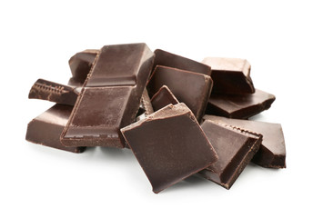 Pieces of dark chocolate on white background
