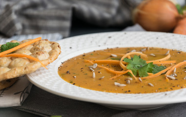 Carrot soup with curry and fresh coriander