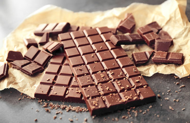 Tasty milk chocolate on table