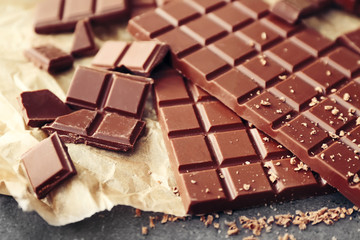 Tasty milk chocolate on table