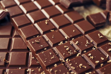 Tasty milk chocolate on table, closeup