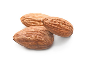 Tasty almond nuts on white background