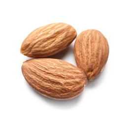 Tasty almond nuts on white background