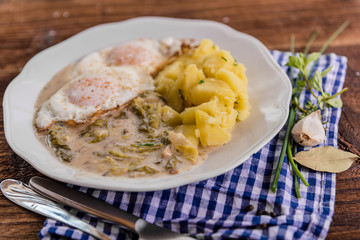 vegetarian meal lettuce sauce with potatoes and fried egg 