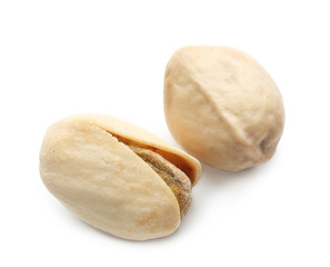 Tasty pistachio nuts on white background