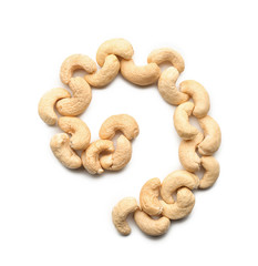 Obraz premium Spiral made of tasty cashew nuts on white background