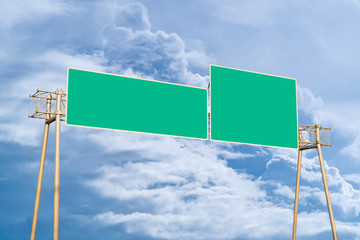 Traffic sign: A large green road overhead marker with space to enter text. cloudy sky background. Copy space.