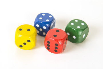 Four colorful gaming dices on a white background background in random order
