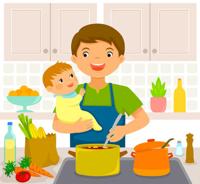 Young man cooking in the kitchen while holding a baby