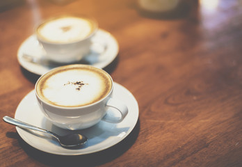 A cup of coffee on a wooden table is indispensable in the morning.This image is Soft Focus.