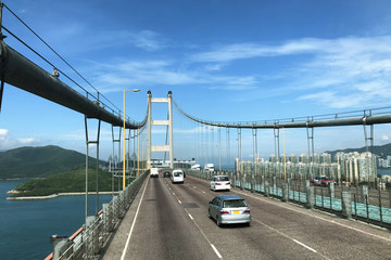 Hong Kong. Tsing Ma Bridge is one of longest span suspension bridges in the world which links Hong Kong New Territories and Lantau Island. A part of huge bridge with city transport. 