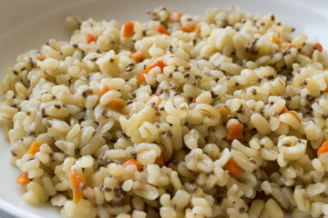 Cooked Bulgur Rice with Chia Seeds and Carrot in Plate Ready to Eat / Bulghur for Pilav or Pilaf