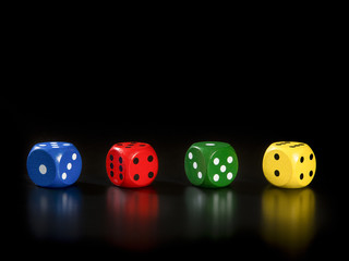 Four colorful gaming dices in a row on a black background