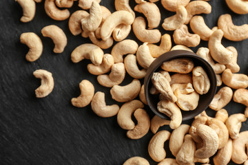 Tasty scattered cashew nuts on slate plate