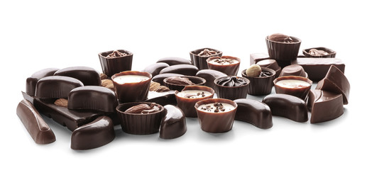 Different chocolate candies on white background