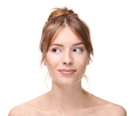 Obraz premium Beautiful young woman with silky skin on white background