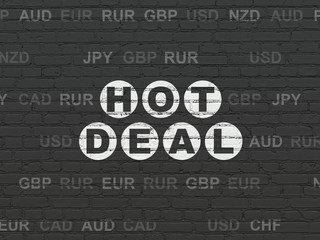 Finance concept: Painted white text Hot Deal on Black Brick wall background with Currency