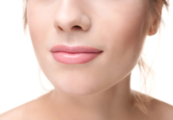 Obraz premium Beautiful young woman with silky skin on white background, closeup